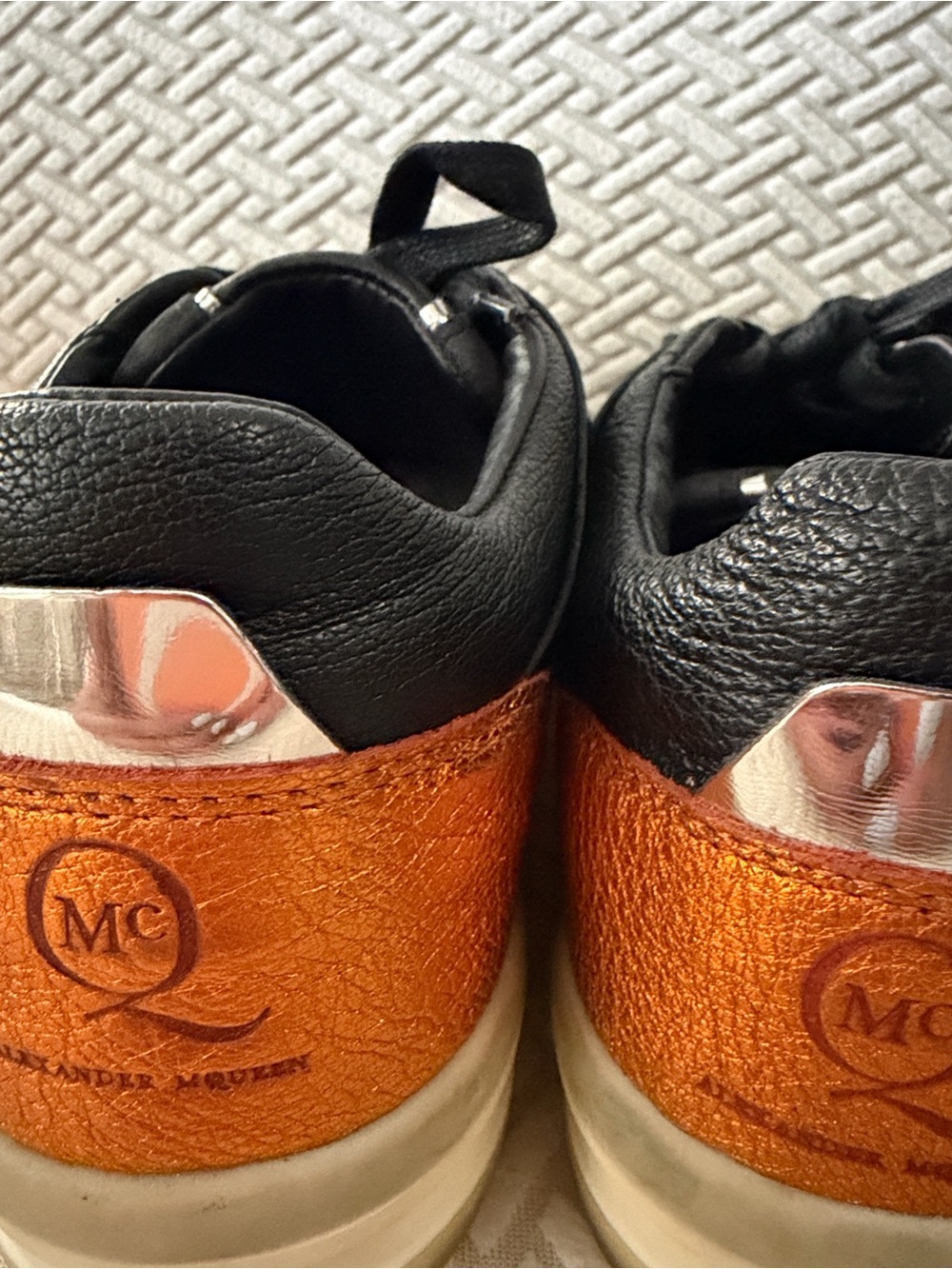 Alexander McQueen Black Leather Sneakers with Orange Heel Accent and Cream Sole